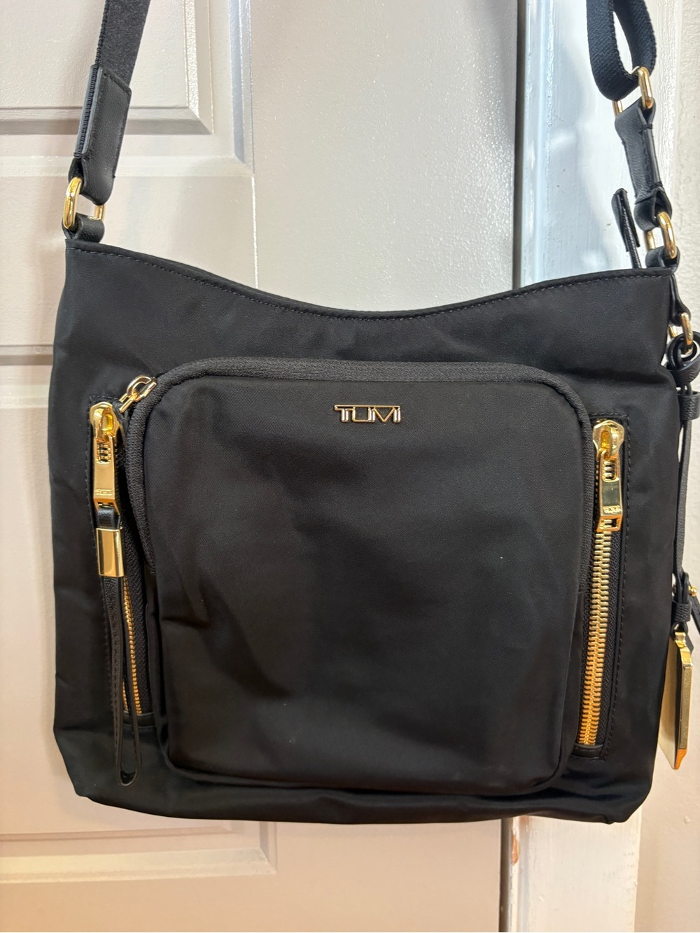 Tumi Black Nylon Crossbody with Gold-Tone Zippers
